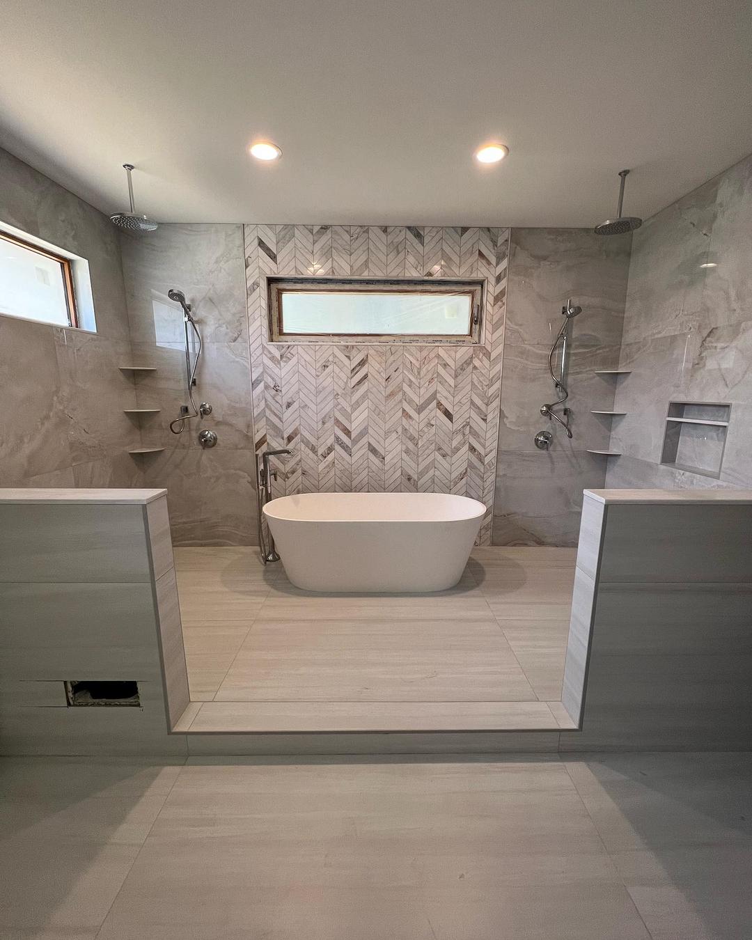 Large Master bath with showers on the left and right. A soaker tub between them.